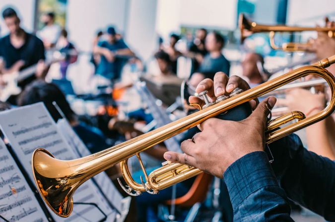 playing trumpet in an orchestra