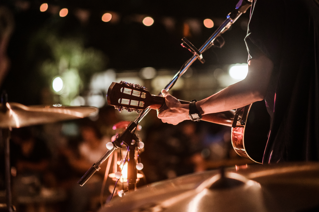 musicians playing rock music on stage