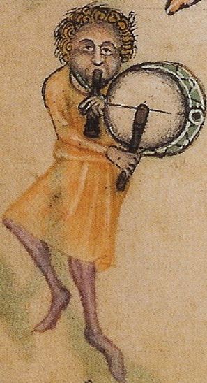 A depiction of a pipe and tabor player, dating from 1325–1335