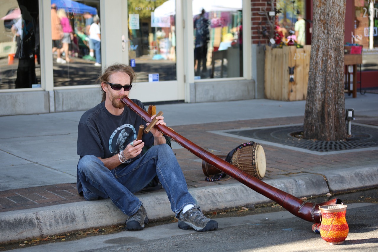 A photo of a man playing the didgeridoo