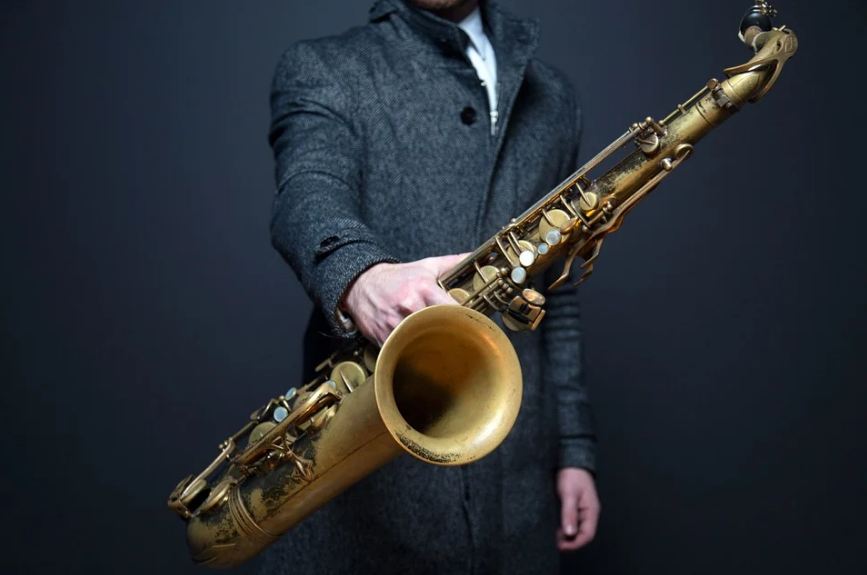 man holding a saxophone